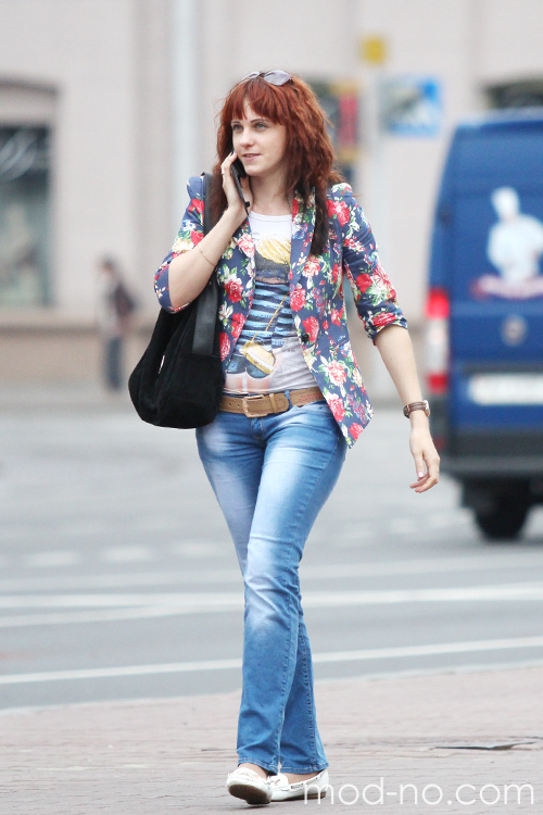 Minsk street fashion. 06/2014 (looks: flowerfloral blazer, printed top, black bag, sky blue jeans, white ballerinas, brown belt)